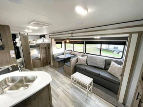 RV located on private property, providing access to the Guadalupe River, accommodates up to 5 guests